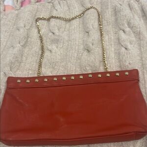 Elegant Red Leather Bag with Gold Chain